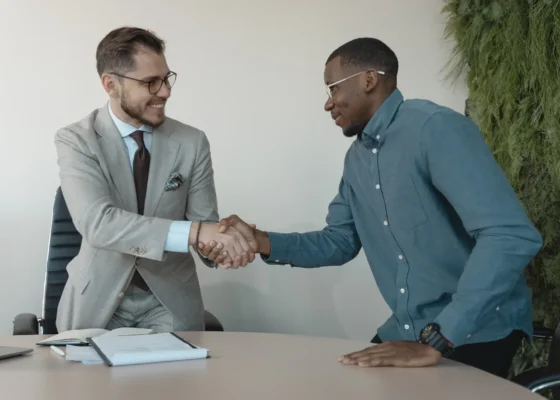 two people shaking hands during healthcare assistant interview questions