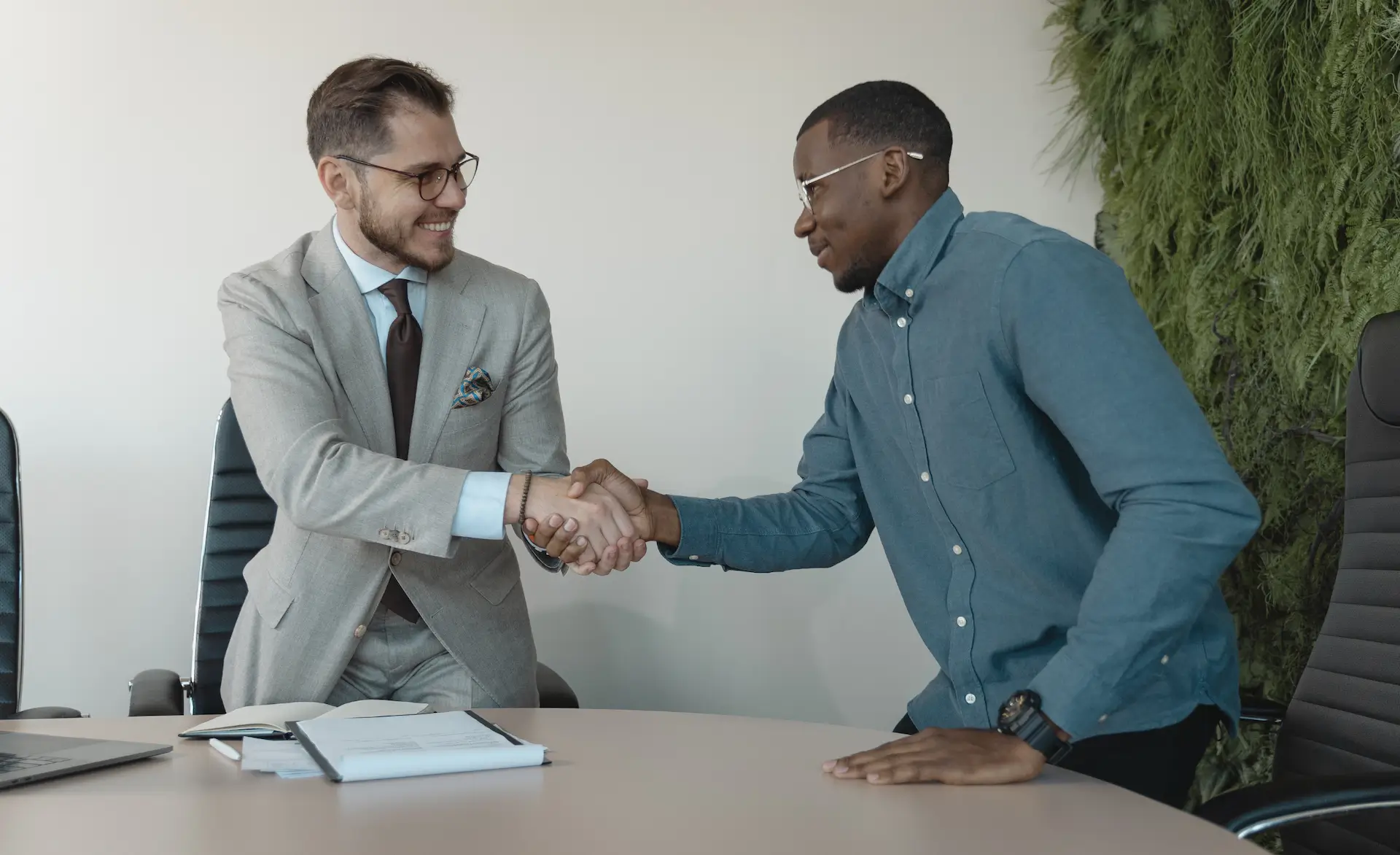 two people shaking hands during healthcare assistant interview questions