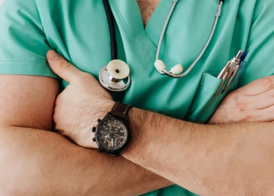 a zoomed in image of an agency nurse crossing their arms