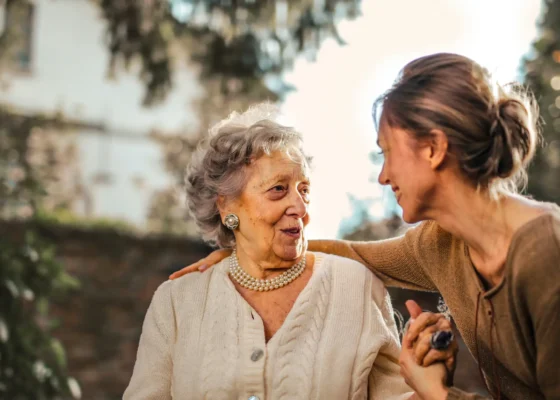 a care worker with her arm round a patient showing strong care worker skills