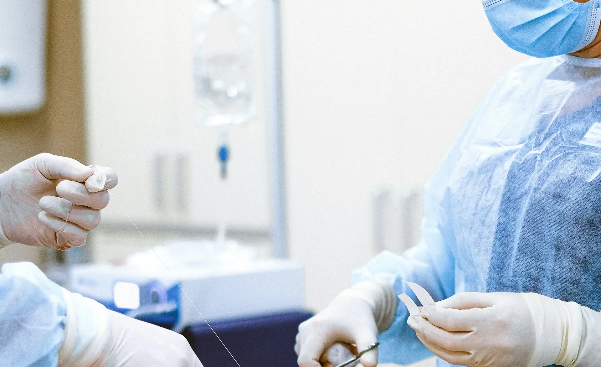 an image of operators cutting stitching string during an operation