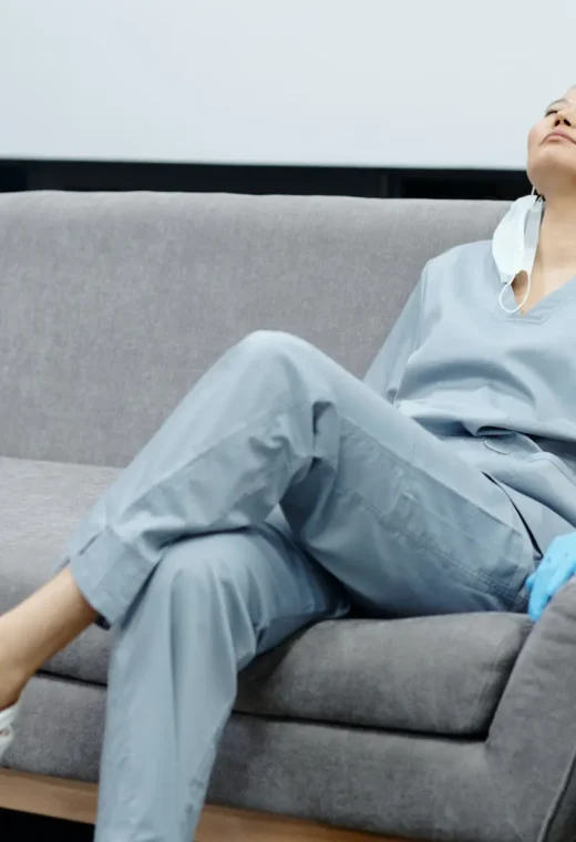 an image of a healthcare assistant sat on a couch