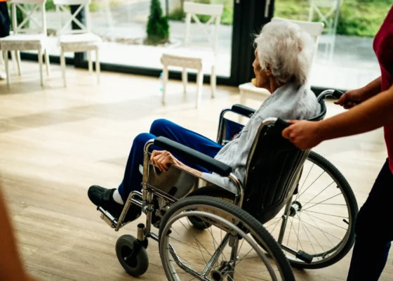 older lady being pushed in a wheelchair