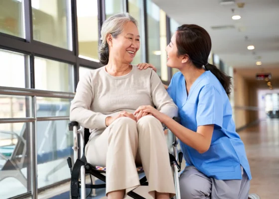 a healthcare assistant talking with a patient