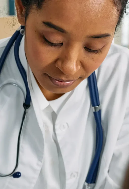 image of a healthcare assistant working on a patient off the frame