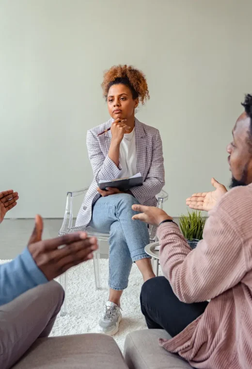 an image of 3 healthcare staff having a discussion