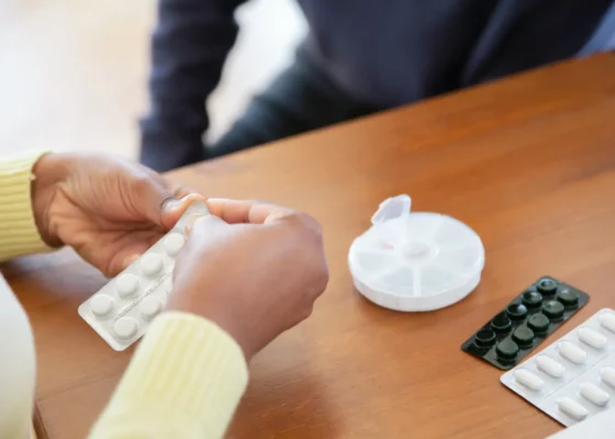 image of a person holding tablets