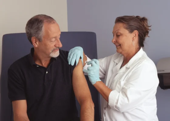 image of a nurse giving an injection to a patient