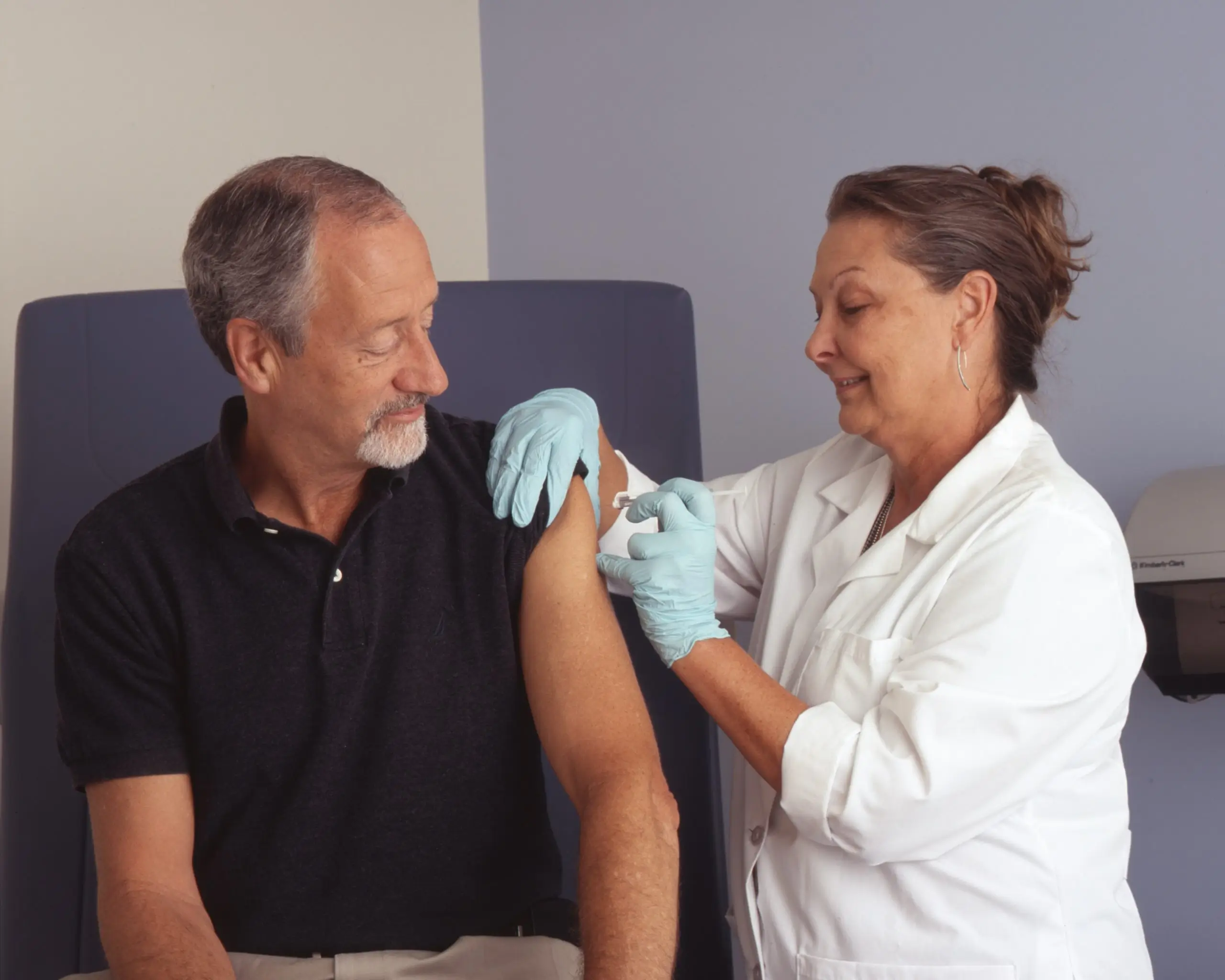 image of a nurse giving an injection to a patient