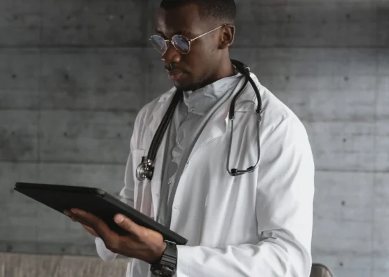 image of a man using an ipad looking at social media in healthcare