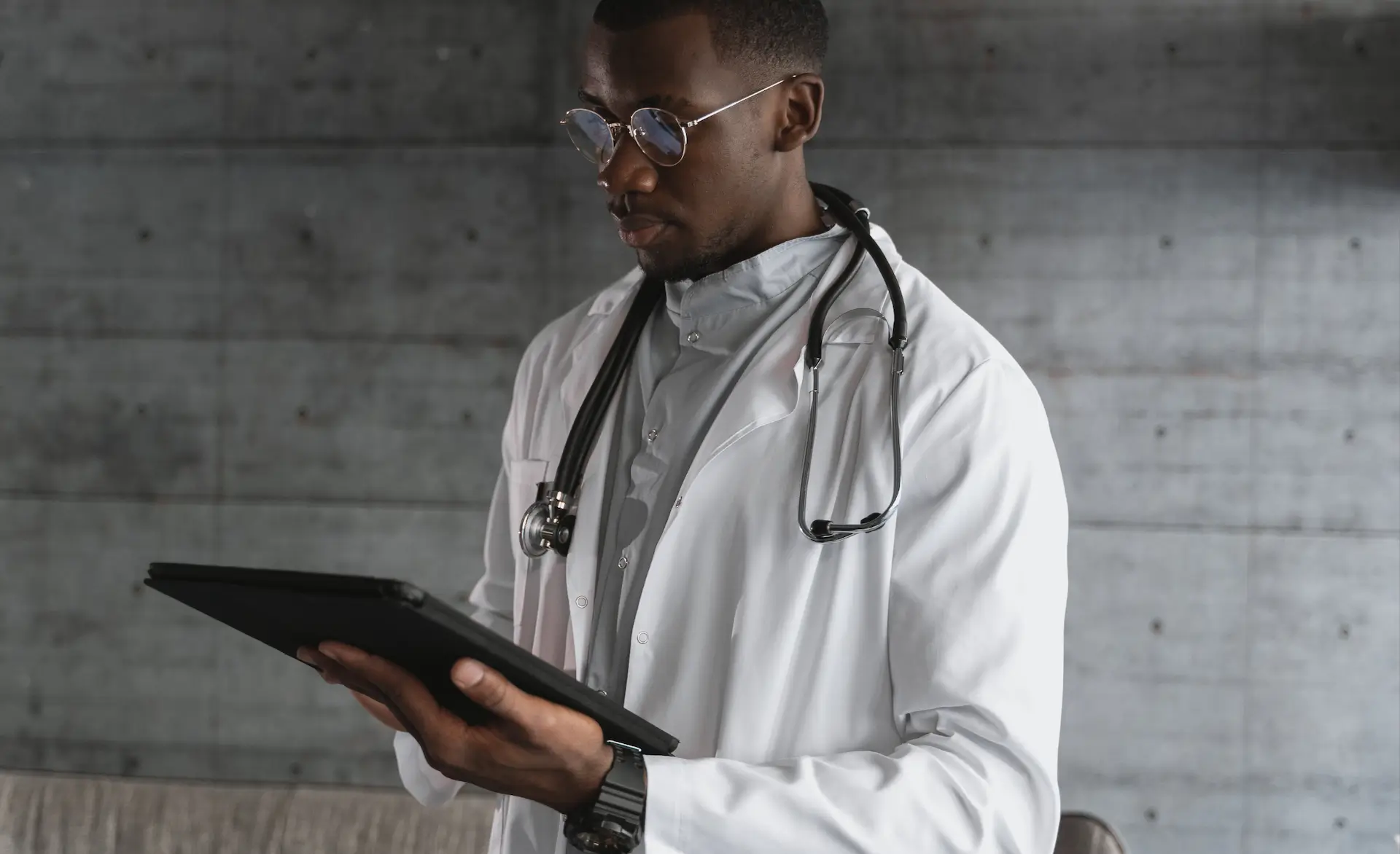 image of a man using an ipad looking at social media in healthcare