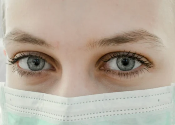 close up image of a face of a healthcare professional wearing PPE