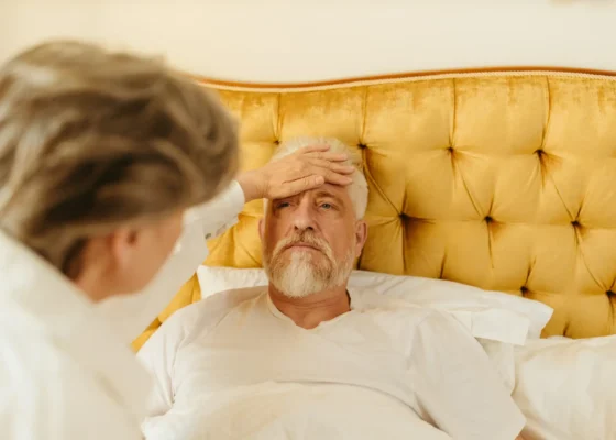 a woman caring for an elderly gentleman