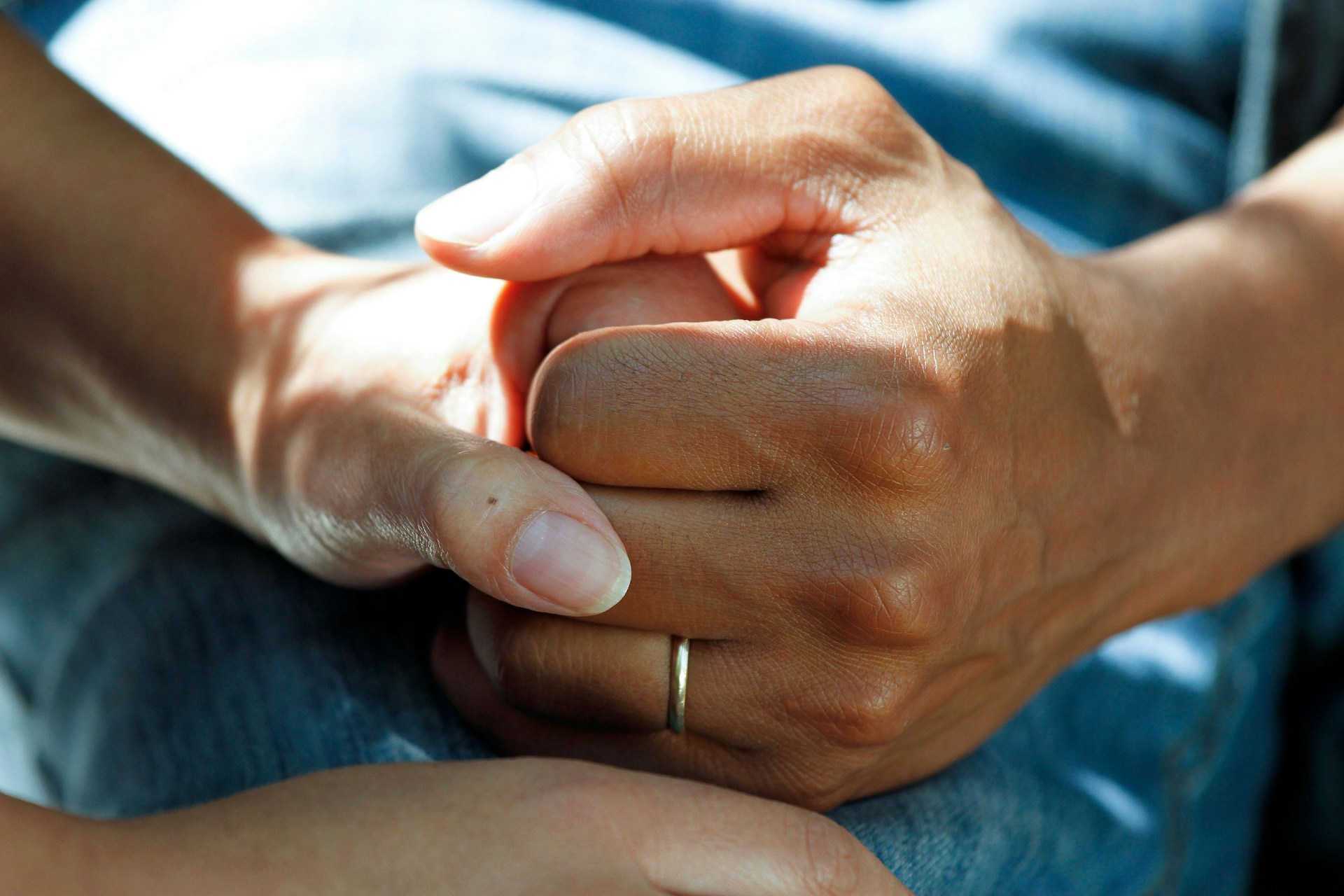 Two hands holding for starting out as a children's home manager